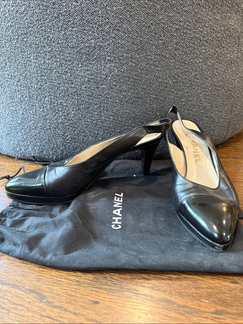 CHANEL Black Leather Slingback Pumps with Gloss Cap Toe